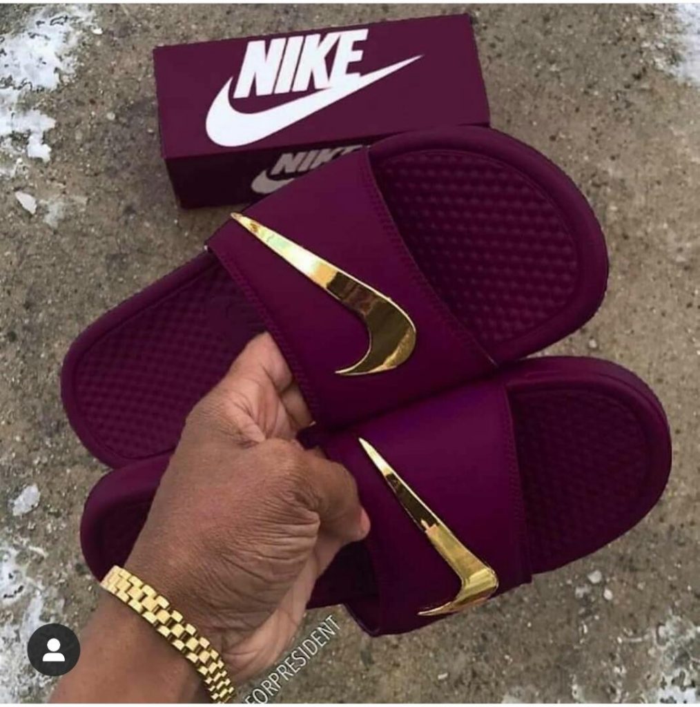 nike slides with gold logo